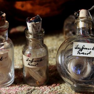 Infant hair in a vintage vial