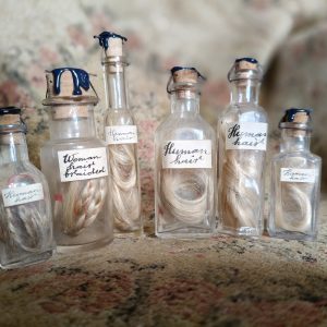 Human hair – natural – in a vintage vial